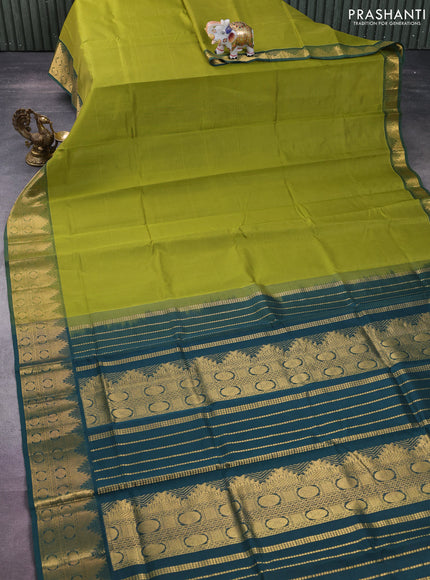 Silk cotton saree light green and green with plain body and zari woven border