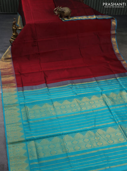 Silk cotton saree maroon and teal blue with plain body and zari woven border