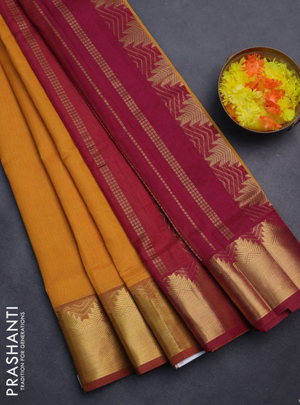 Silk cotton saree mustard yellow and maroon with plain body and zari woven border
