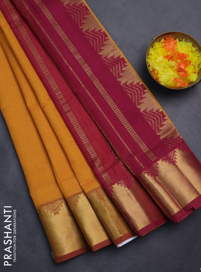 Silk cotton saree mustard yellow and maroon with plain body and zari woven border