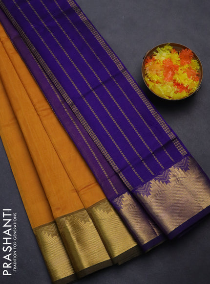 Silk cotton saree mustard yellow and blue with plain body and zari woven border