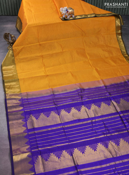 Silk cotton saree mustard yellow and blue with plain body and zari woven border