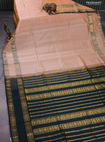 Silk cotton saree pale orange and black with plain body and rettapet zari woven border