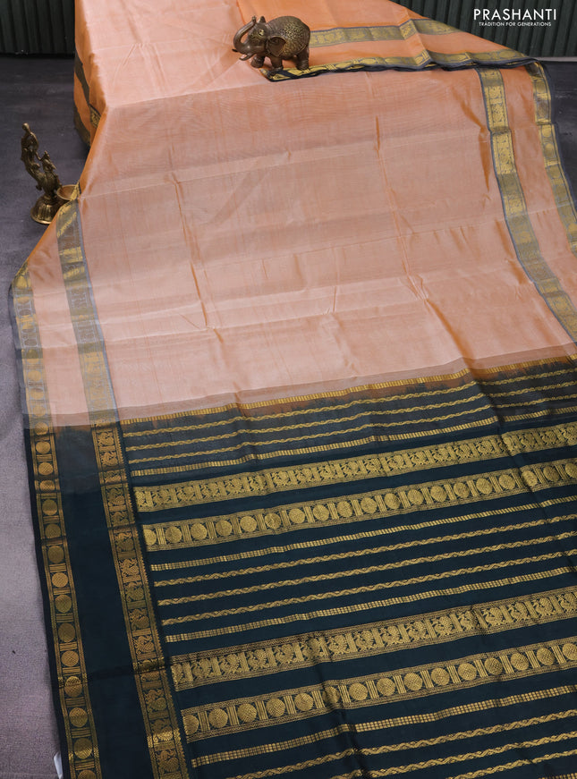Silk cotton saree pale orange and black with plain body and rettapet zari woven border