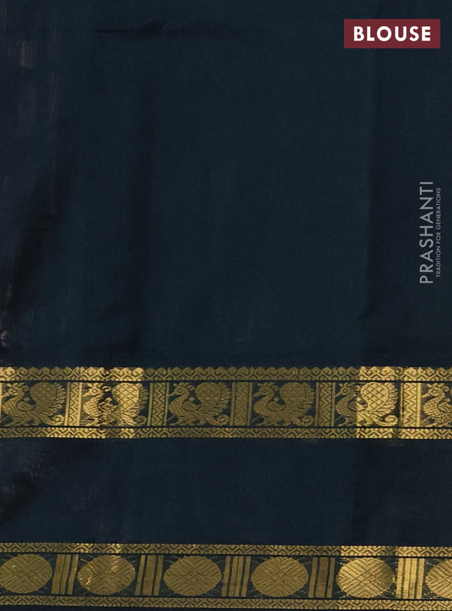 Silk cotton saree pale orange and black with plain body and rettapet zari woven border