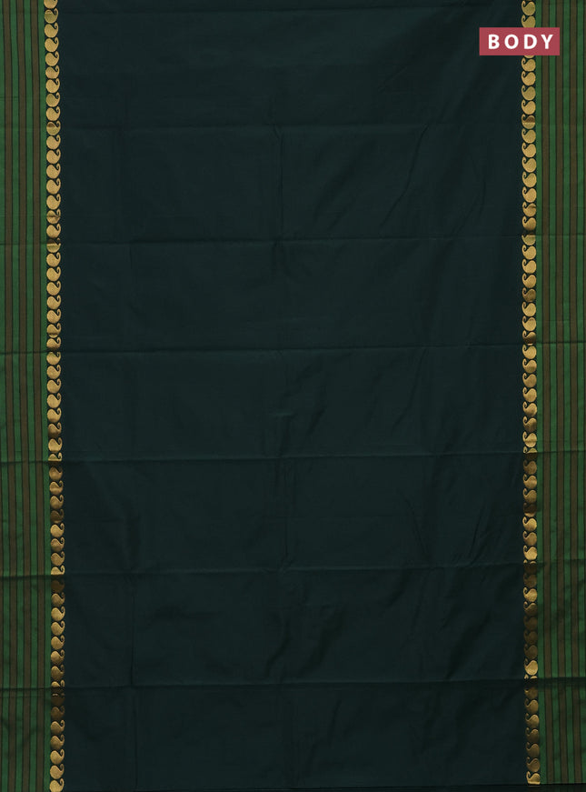 Arani semi silk saree bottle green and mustard yellow with plain body and paisley zari woven simple border