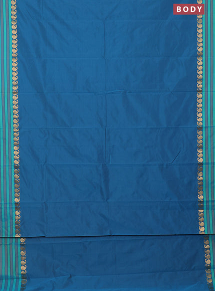 Arani semi silk saree peacock blue and teal green with plain body and paisley zari woven simple border