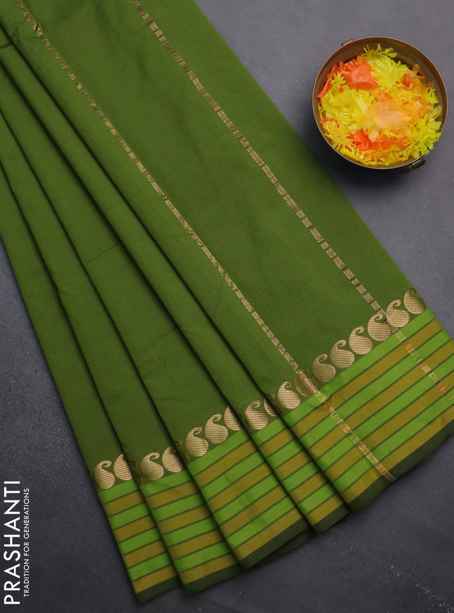 Arani semi silk saree sap green and mustard yellow with plain body and paisley zari woven simple border
