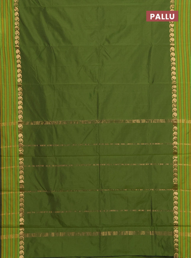 Arani semi silk saree sap green and mustard yellow with plain body and paisley zari woven simple border