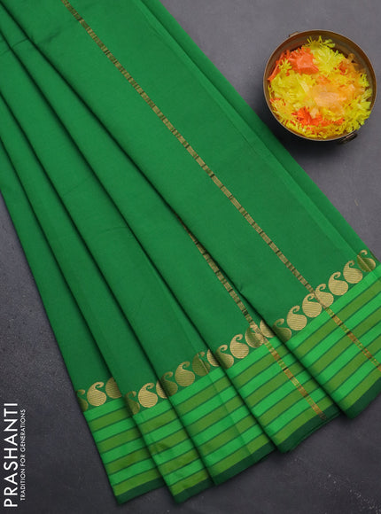 Arani semi silk saree green and light green with plain body and paisley zari woven simple border