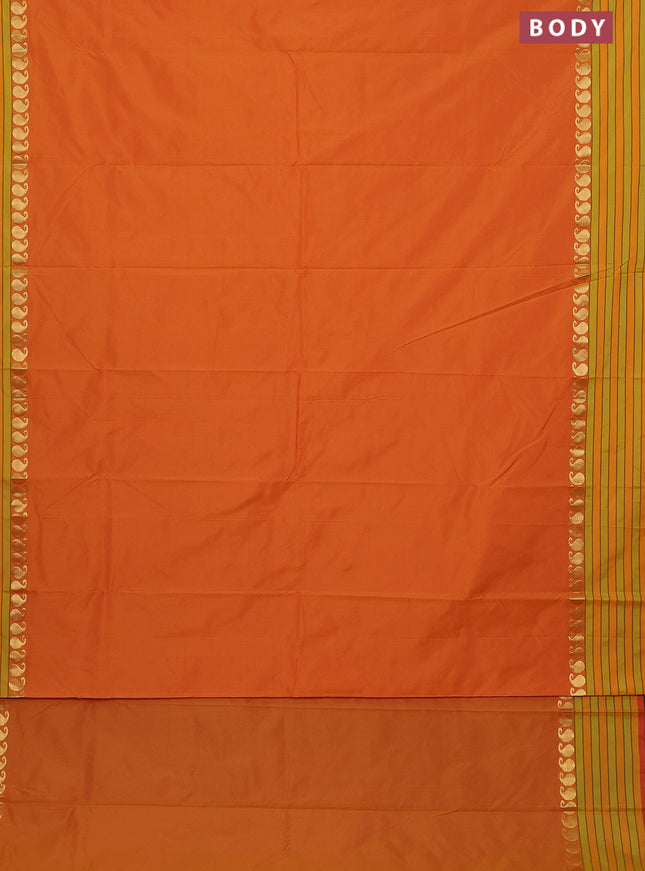 Arani semi silk saree dual shade of mustard yellow and light green with plain body and paisley zari woven simple border