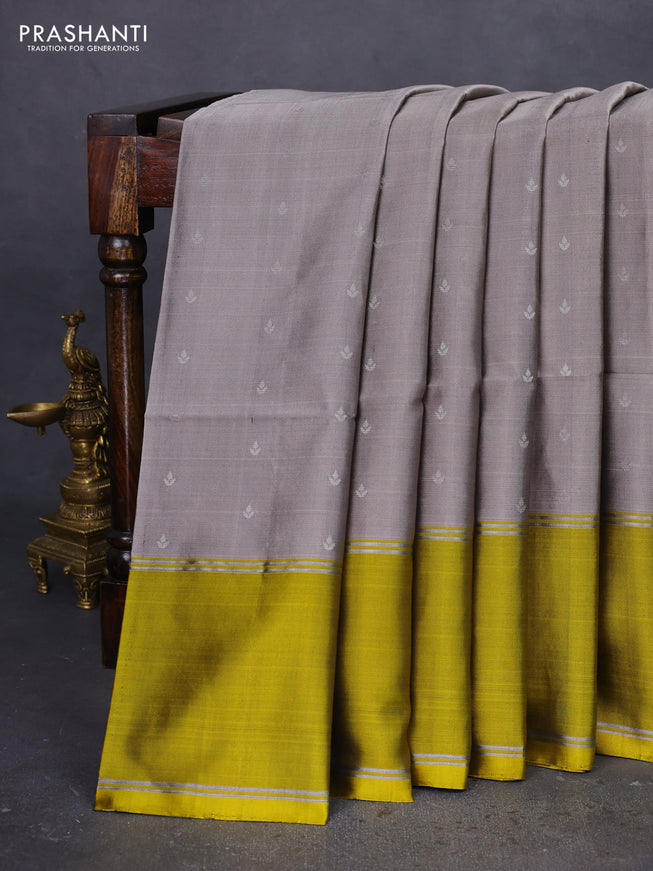 Pure soft silk saree grey and yellow with silver zari woven buttas and rettapet zari woven border