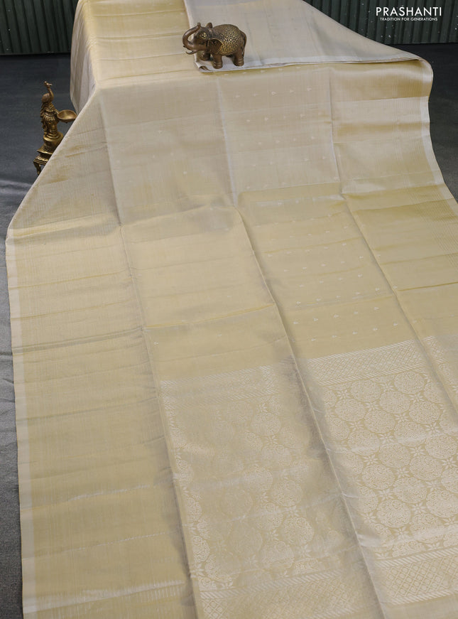 Pure soft silk saree beige with allover zari woven buttas and zari woven border