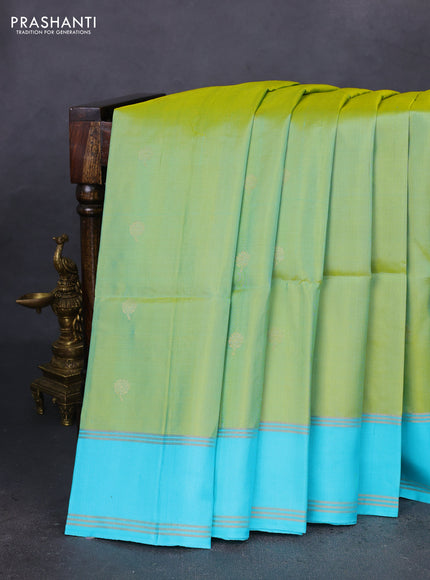 Pure soft silk saree dual shade of light green and teal blue with zari woven floral buttas and rettapet zari woven border