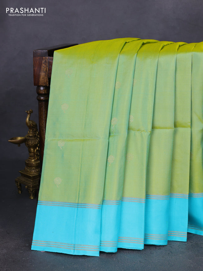 Pure soft silk saree dual shade of light green and teal blue with zari woven floral buttas and rettapet zari woven border