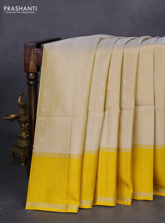 Pure soft silk saree cream and yellow with silver zari woven buttas and rettapet silver zari woven border