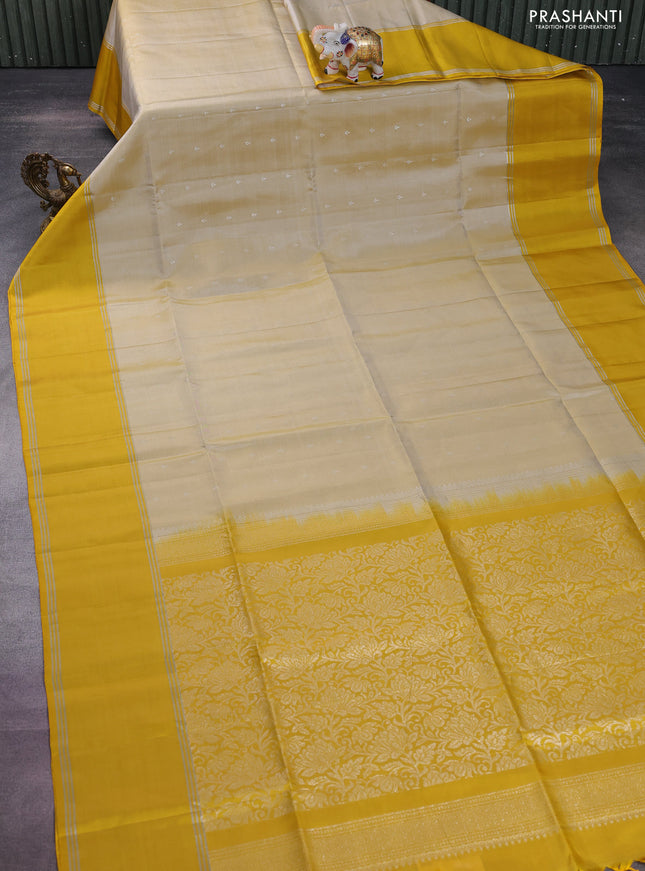 Pure soft silk saree cream and yellow with silver zari woven buttas and rettapet silver zari woven border