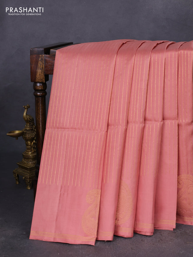 Pure soft silk saree pastel peach with allover zari weaves and zari woven butta border