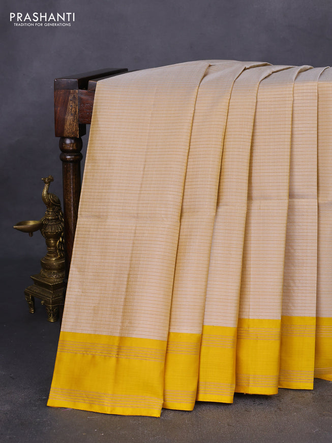 Pure soft silk saree beige and yellow with allover zari checked pattern and rettapet zari woven border