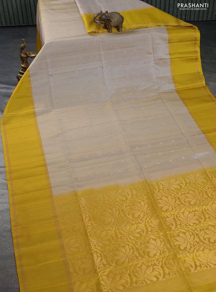 Pure soft silk saree beige and mustard yellow with zari woven buttas and rettapet zari woven border