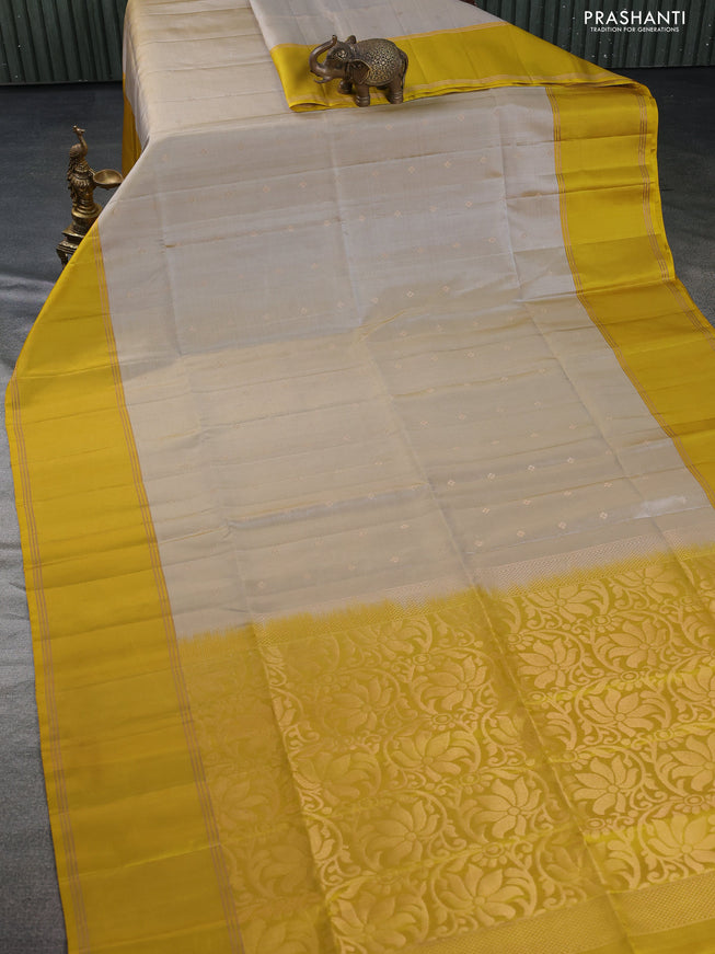 Pure soft silk saree beige and mustard yellow with zari woven buttas and rettapet zari woven border