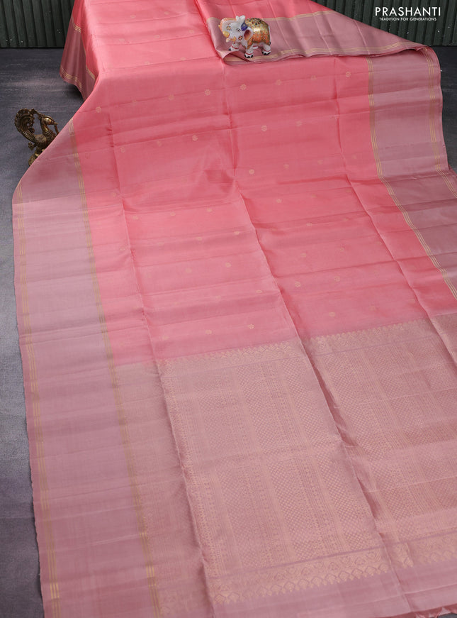 Pure soft silk saree peach pink and pastel peach with zari woven floral buttas and rettapet zari woven border
