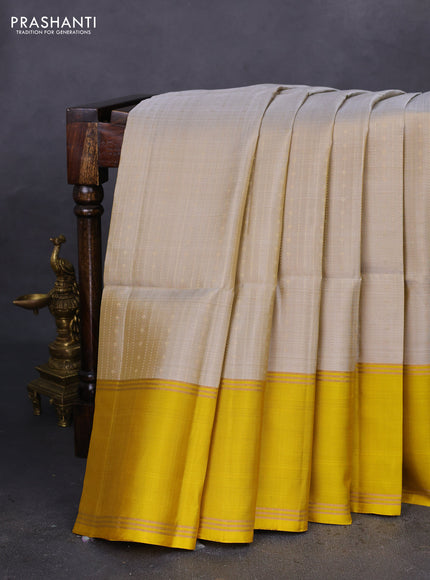 Pure soft silk saree grey shade and mustard yellow with allover zari weaves and rettapet zari woven border