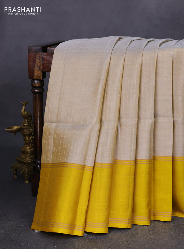 Pure soft silk saree grey shade and mustard yellow with allover zari weaves and rettapet zari woven border