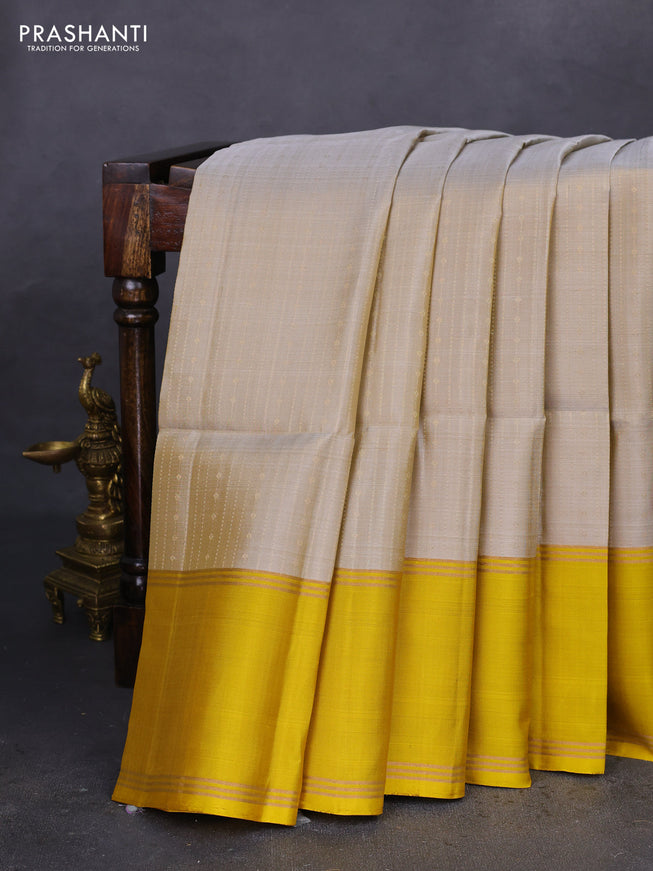 Pure soft silk saree grey shade and mustard yellow with allover zari weaves and rettapet zari woven border