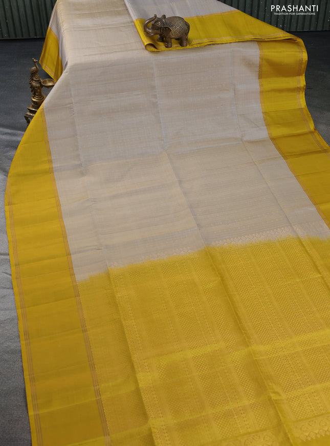 Pure soft silk saree grey shade and mustard yellow with allover zari weaves and rettapet zari woven border