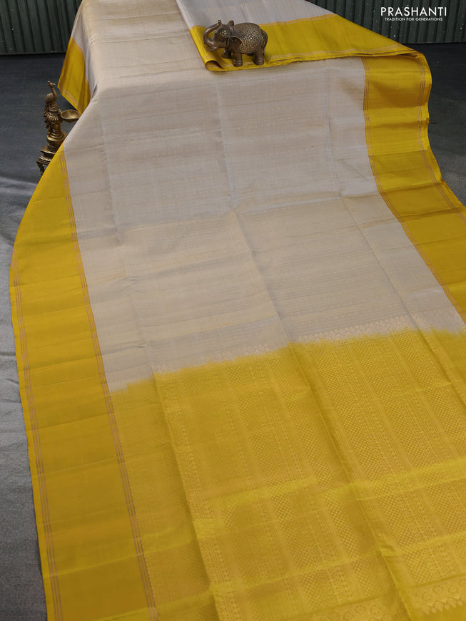 Pure soft silk saree grey shade and mustard yellow with allover zari weaves and rettapet zari woven border
