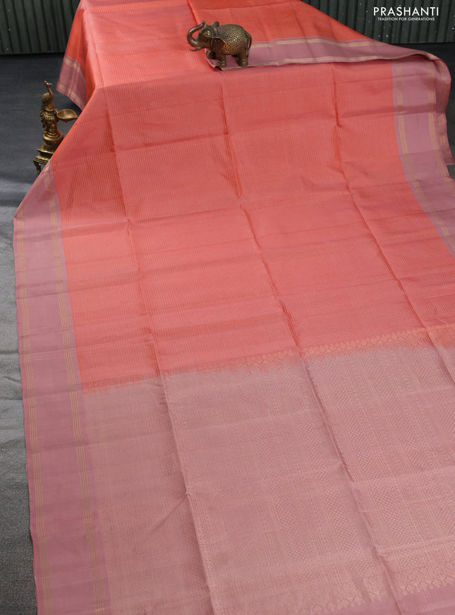 Pure soft silk saree peach shade and pastel peach with allover zari checked pattern and rettapet zari woven border