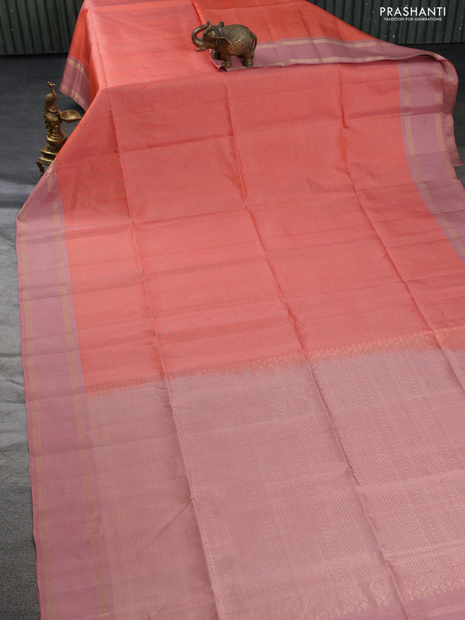 Pure soft silk saree peach shade and pastel peach with allover zari checked pattern and rettapet zari woven border