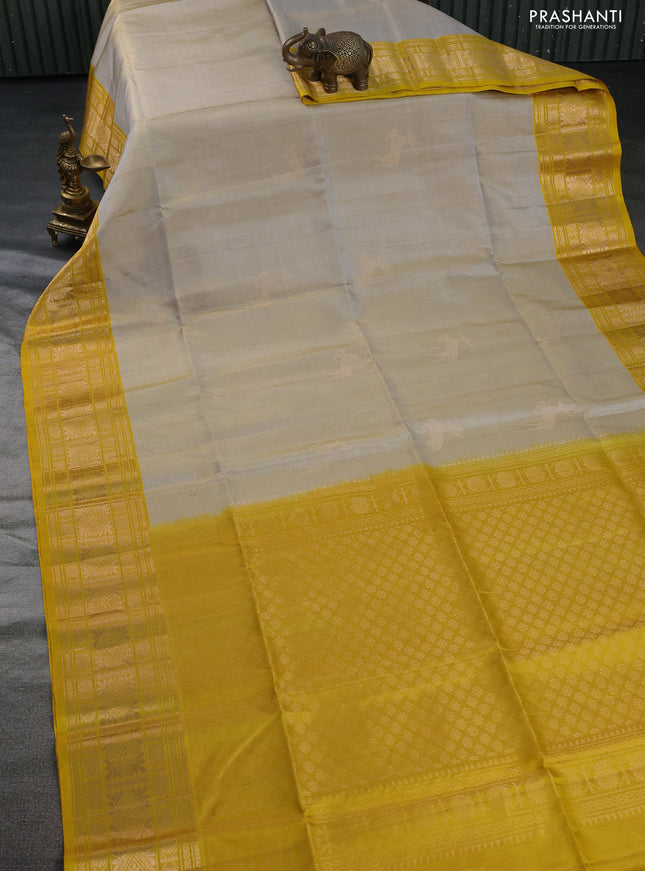 Pure soft silk saree grey shade and yellow with zari woven deer buttas and zari woven border