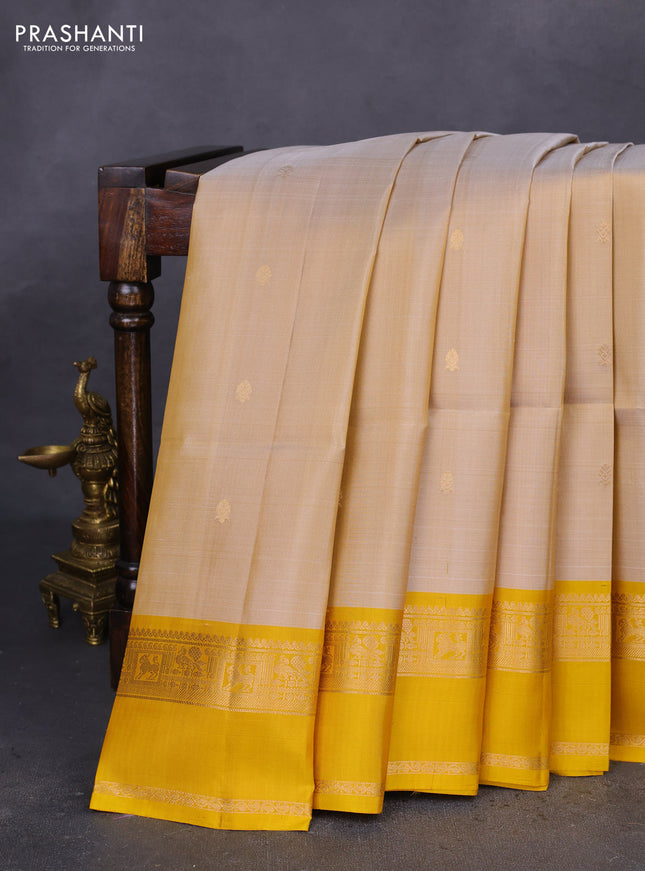 Pure soft silk saree sandal and mustard yellow with zari woven buttas and rettapet zari woven border
