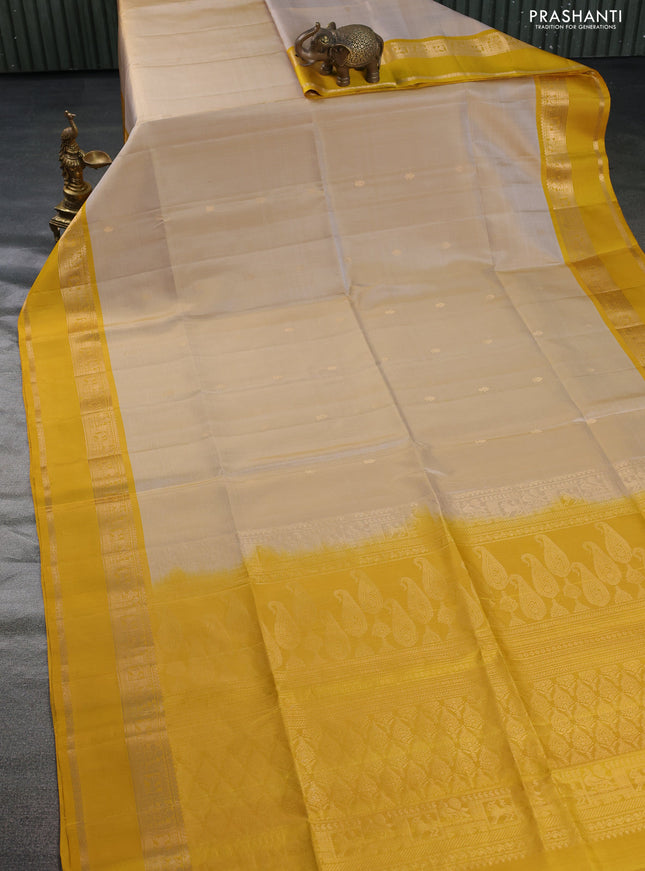Pure soft silk saree sandal and mustard yellow with zari woven buttas and rettapet zari woven border