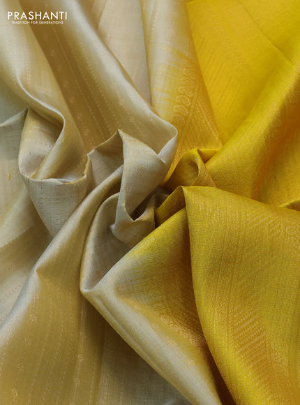 Pure soft silk saree beige and yellow with allover zari weaves and rettapet zari woven border