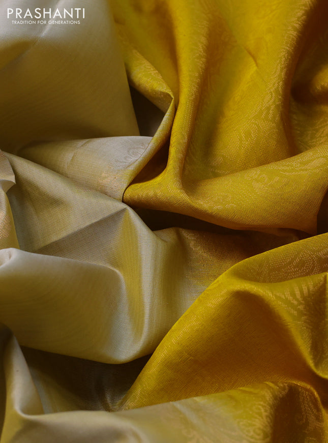 Pure soft silk saree cream and yellow with zari woven floral buttas and rettapet zari woven border