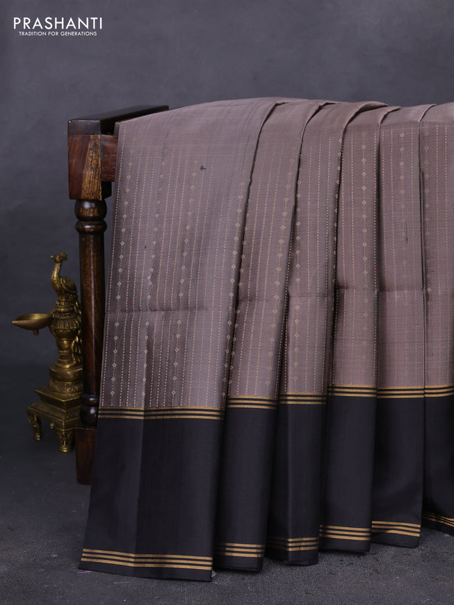 Pure soft silk saree grey and black with allover zari weaves and rettapet zari woven border