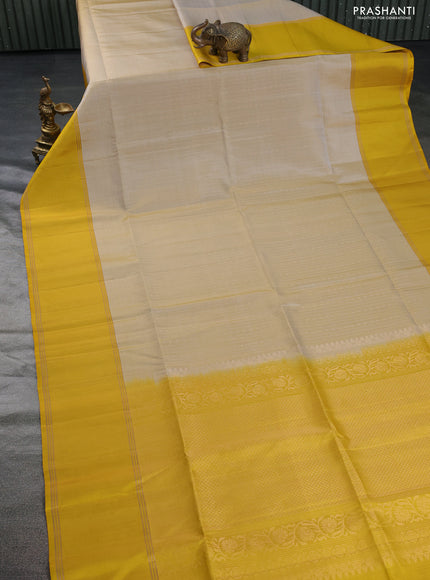 Pure soft silk saree beige and yellow with allover zari weaves and rettapet zari woven border