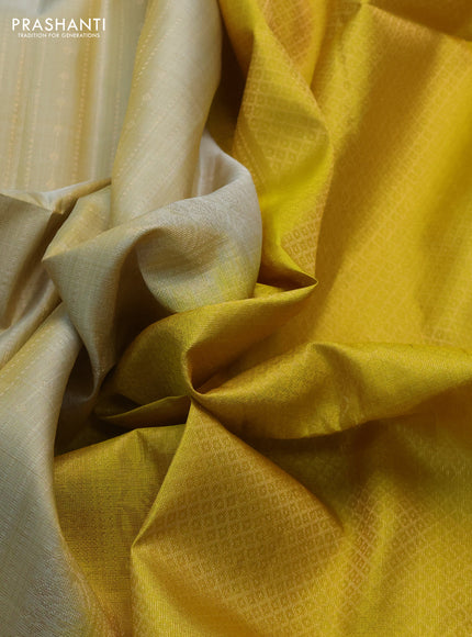 Pure soft silk saree beige and yellow with allover zari weaves and rettapet zari woven border
