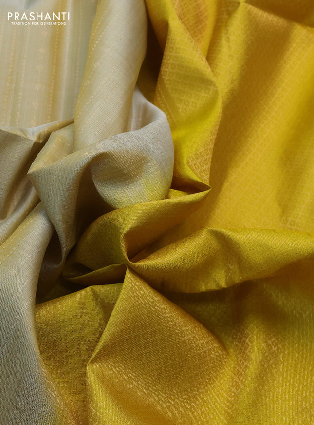 Pure soft silk saree beige and yellow with allover zari weaves and rettapet zari woven border