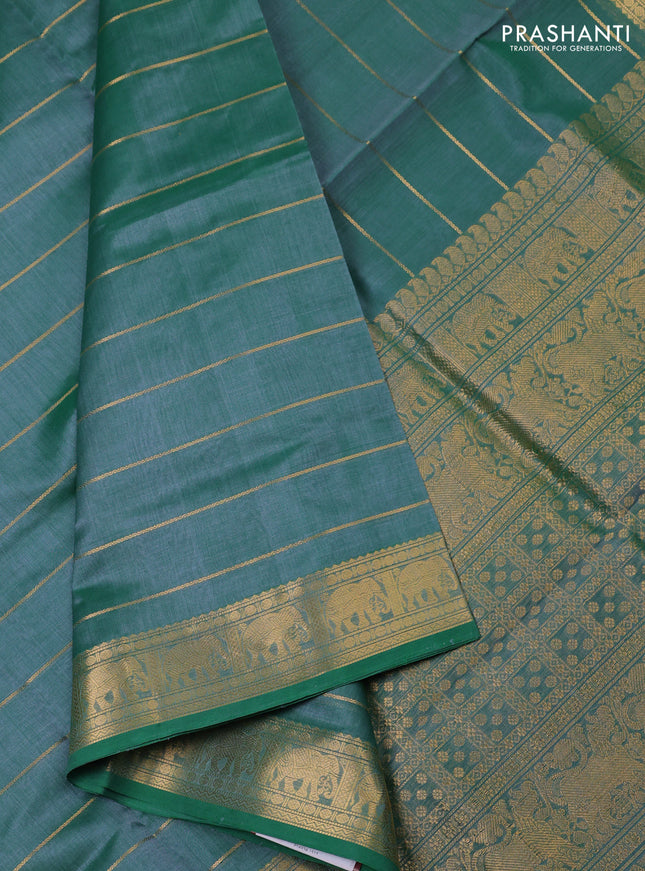 Kanchipuram silk cotton saree green with allover zari stripe pattern and elephant zari woven border