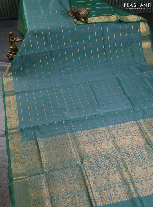 Kanchipuram silk cotton saree green with allover zari stripe pattern and elephant zari woven border