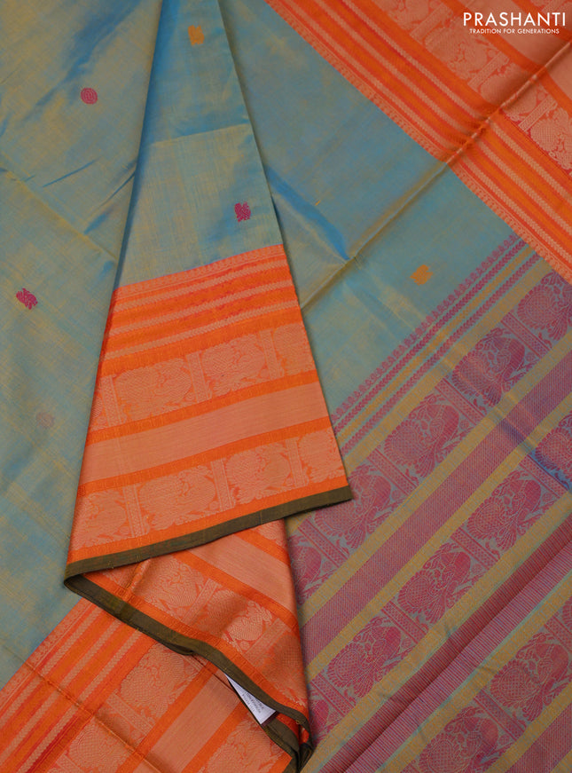 Kanchipuram silk cotton saree dual shade of yellowish teal and orange with thread woven buttas and thread woven border