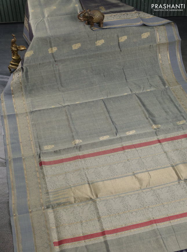 Kanchipuram silk cotton saree grey shade with zari woven buttas and thread woven border