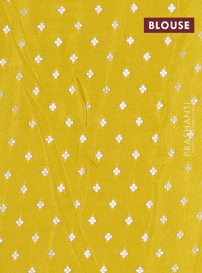 Semi mysore silk saree lime yellow with zari woven floral buttas and long rettapet zari woven border