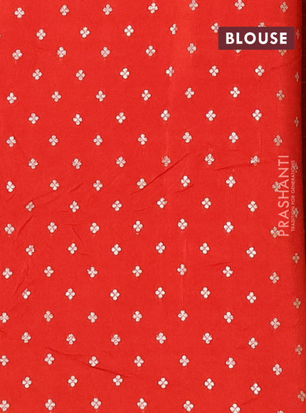 Semi mysore silk saree orange with allover zari checks & buttas and zari woven butta border