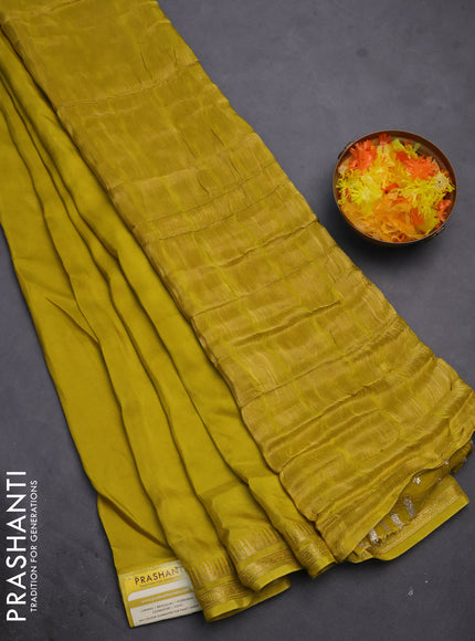 Semi mysore silk saree lime yellow with plain body and temple design zari woven border