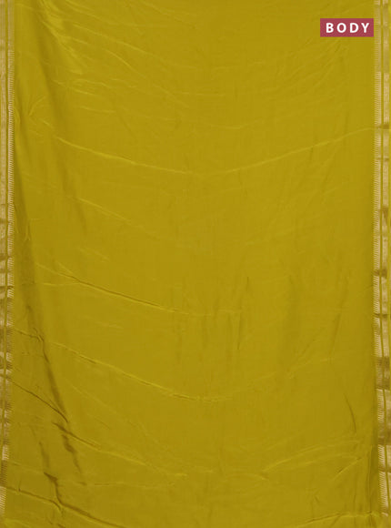 Semi mysore silk saree lime yellow with plain body and temple design zari woven border